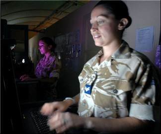 Army Cpl Lisa Dowling and Navy AB Amy Cooperthwaite using the Military’s secure communications Joint Operational Command System (JOCS) in the command Headquarters