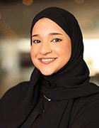 Photo of Amna AlMarzooqi, racecar mechanic at the Abu Dhabi Autonomous Racing League (A2RL)