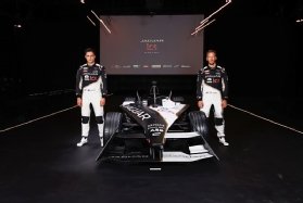 Photo of Jaguar TCS launch drivers Mitch Evans (left) and Sam Bird (right) with electric racing car.