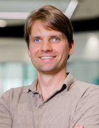 Headshot of Klemensas Mecejus from AI71.