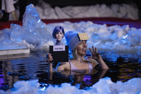 Photo of Aura Pyykönen, medical lead of Finland’s Natal Mind, making her pitch in a hole in the ice.
