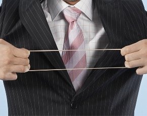 businessman stretching rubber band