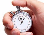 hand holding stop clock