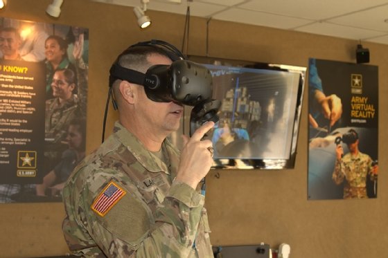 A visitor to the Army Marketing and Engagement Brigade gets acquainted with virtual reality tech in one of the unit's display vehicles.