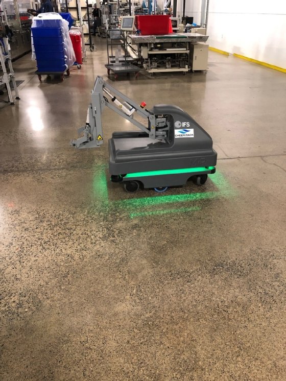 This shows Cheer Pack using mobile industrial robots from MIR and powered by IFS software to move goods in its warehouse operations.