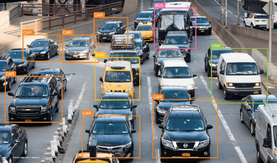 Example of image recognition identifying different types of vehicles on a road.